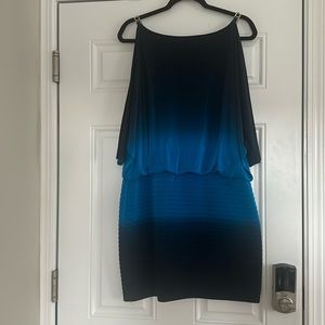 Blue cocktail dress with open draped shoulders and 3 quarter length sleeves